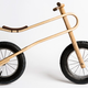 Illustration for article titled Kids Will Always Have a Comfy Ride On this Curvy Plywood Balance Bike
